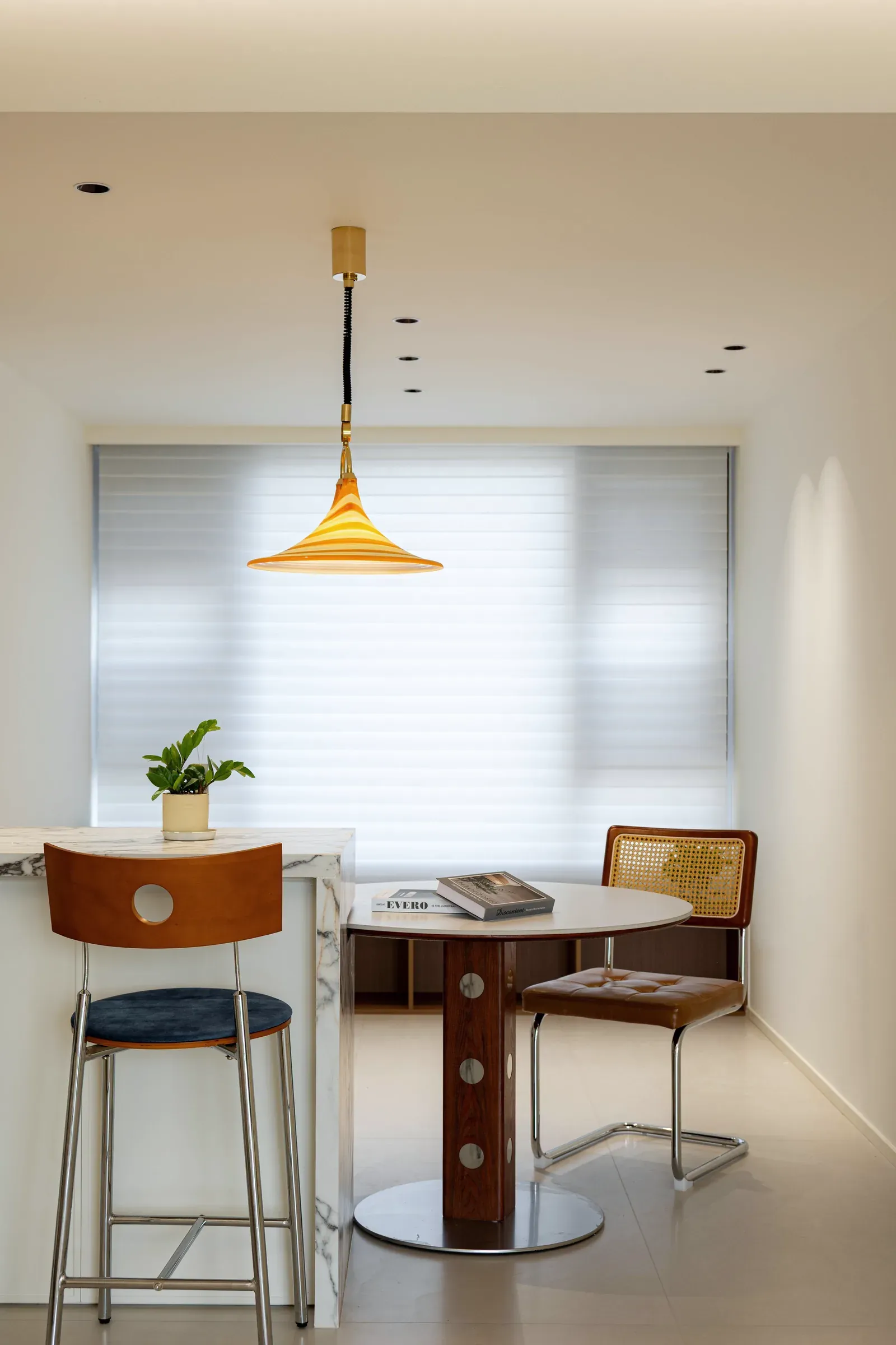 Dining nook under a pendant light